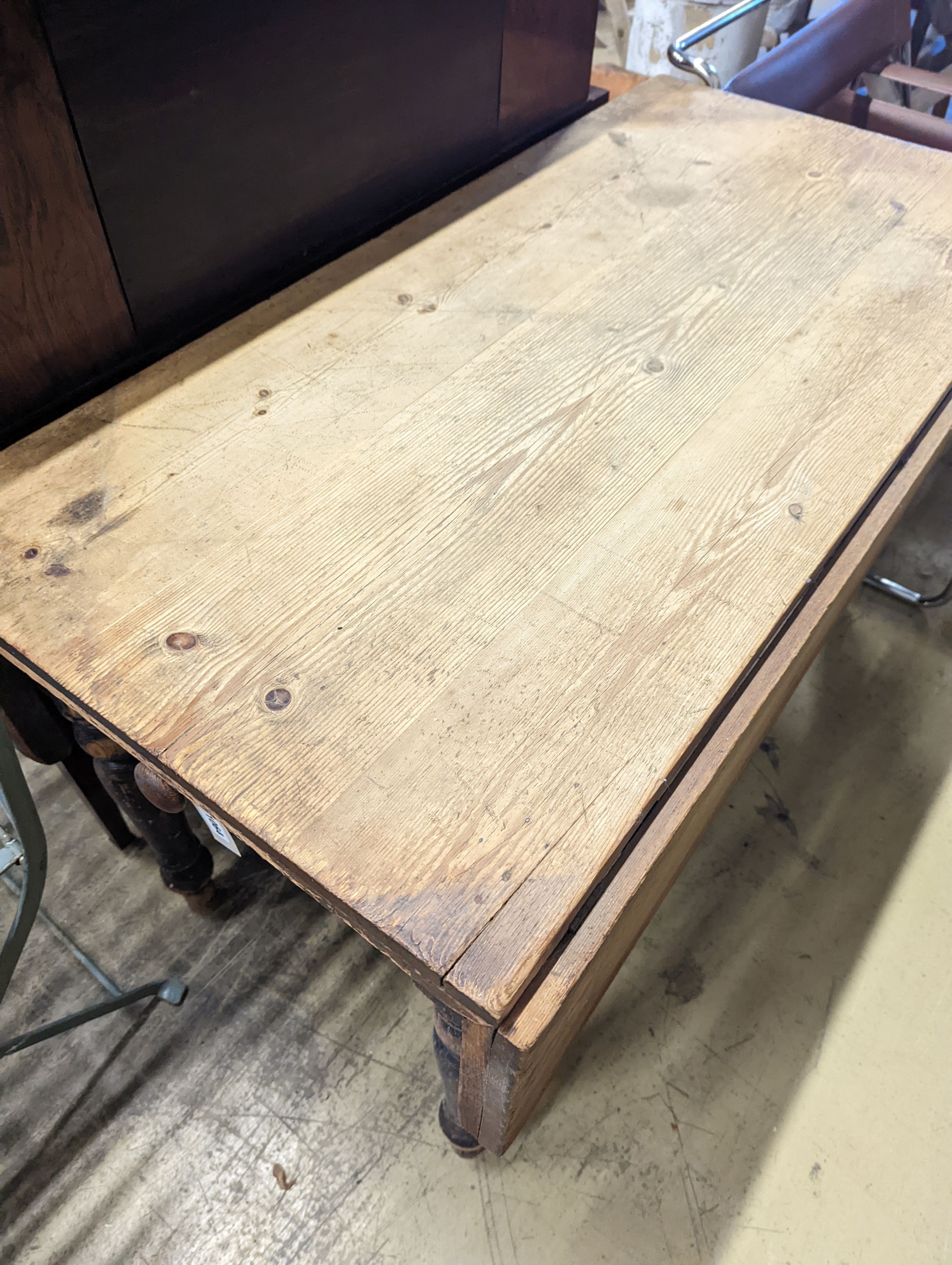 A Victorian pine drop flap kitchen table fitted drawer, width 122cm, length 117cm extended, height 70cm